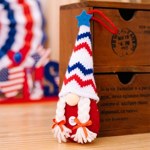 Detail of Fourth of July gnome with red, white, blue knitted hat and white braids