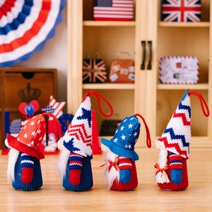 Set of four patriotic American independence day gnomes with hanging ropes on wood background