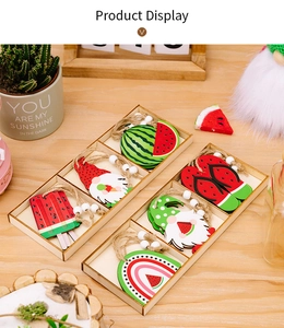 Detail of summer wooden watermelon gnome pendants and slippers in a wooden box
