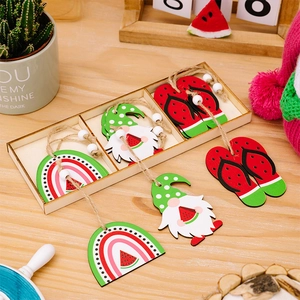 Macro view of summer watermelon gnome and flip-flop wooden ornaments in a wooden box