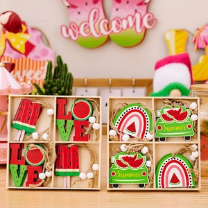 Detail of wooden summer watermelon hanging ornaments with jute rope and white beads