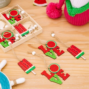 Detail of wooden summer watermelon hanging ornaments with LOVE letters and ice cream shapes
