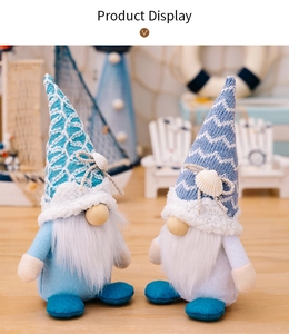 Close-up of summer ocean gnomes with knitted hats and seashell details on display