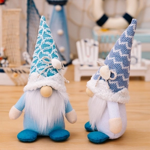 Detail of nautical ocean gnomes featuring knitted hats and real shell decorations