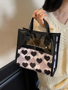 Translucent heart print tote bag with 'Leave love' slogan and black nylon handles