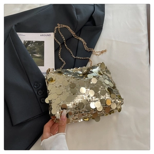 Detailed view of shimmering gold sequins on a trendy chain shoulder bag for women