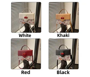 Detailed view of mini cherry print crossbody bags in white, khaki, red and black finishes