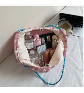 Spacious interior of plaid canvas tote bag showing large capacity for daily essentials