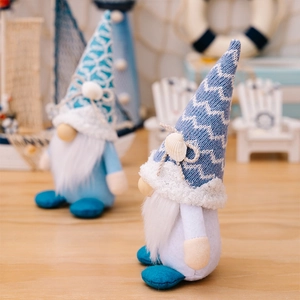 Detailed close-up of knitted nautical gnomes with seashells and ocean wave patterns
