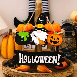 Halloween tiered tray decor featuring wooden gnomes, pumpkins and HALLOWEEN sign