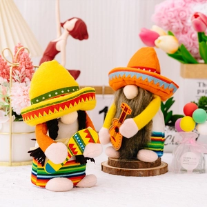 Detail of Mexican party gnomes with sombrero holding a guitar and maracas for fiesta decor