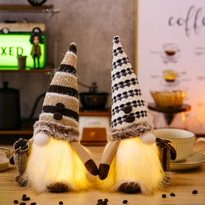 Close-up of lighted coffee gnome dolls with warm LED glow and cozy home decor details