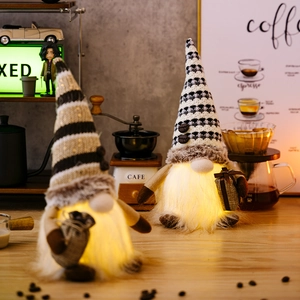 Detail of warm LED lighting on coffee gnomes with knitted hats and plush beards