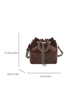Brown drawstring bucket bag with pearl chain detail and adjustable shoulder strap