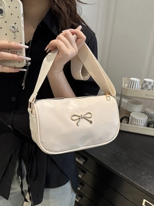 Chic beige square handbag with a metal bow buckle and wide fabric strap for daily wear