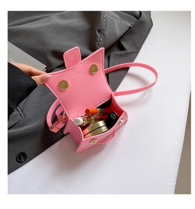 Pink mini crossbody bag interior showing storage space for lipstick and makeup items
