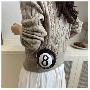 Detail of creative number 8 billiard ball round mini crossbody bag with gold chain strap