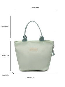 Green nylon tote bag with fashion label and 25x18x12cm size measurements shown