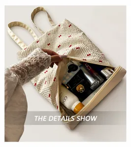 Interior view showing large capacity for cosmetics in beige bow-knot bucket bag