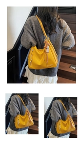 Détail du sac hobo jaune montrant le cuir souple, le gland et la fermeture éclair latérale