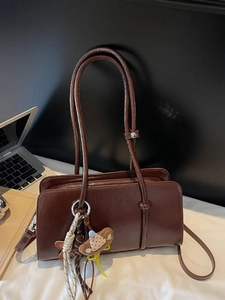 Vintage dark brown faux leather tote bag with stylish bear charm and tassel detail