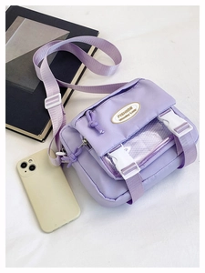 Detail of lavender canvas crossbody bag with transparent PVC window and fashion buckle