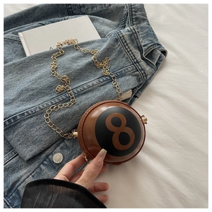 Detail showing creative billiard ball number 8 shape mini crossbody bag with gold chain strap