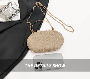 Champagne gold glitter evening clutch size reference with smartphone and chain strap