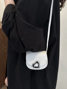 Mini white leather crossbody bag with elegant heart metal clasp and thin strap