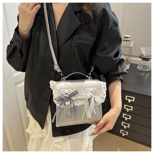 Silver balletcore crossbody bag featuring delicate lace edges and bow details