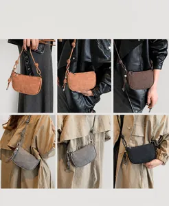 Detail showing the adjustable knotted strap and matte texture of the crossbody bag