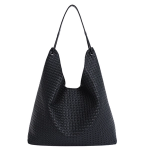 Minimalist black woven leather tote bag with shoulder straps for daily commuting