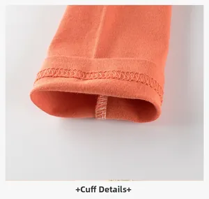 Detailed close-up of orange long-sleeve T-shirt cuff with double-needle stitching