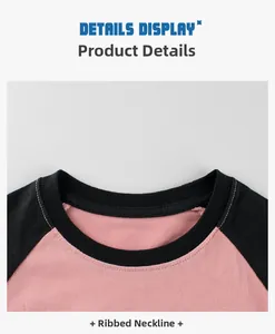 Detail of ribbed neckline and raglan sleeve stitching on pink and black long sleeve t-shirt