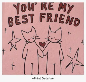 Close-up of pink knit t-shirt featuring cat illustration and best friend text print