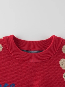 Red knit crewneck sweater for children featuring white polka dots and ribbed neckline detail