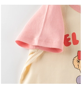 Close-up of raglan sleeve stitching and premium cotton fabric on girls cartoon t-shirt