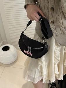 Chic black nylon crescent shoulder bag with pink embroidery on adjustable wide strap