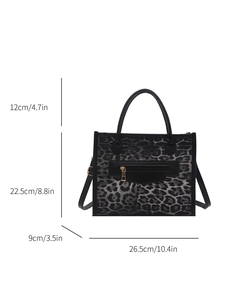 Trendy leopard print tote bag with metal zipper and adjustable strap on white background