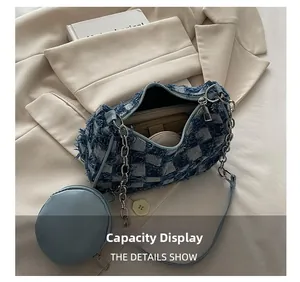 Interior view showing the storage capacity of the blue checkered denim dumpling bag