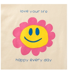 Close-up of beige cotton girls' tee featuring a smiling sun flower and motivational text