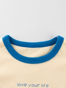 Girl's cream cotton T-shirt with navy blue crew neck and Love Your Life print