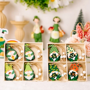 Detail of St. Patrick's Day wooden gnomes with LUCK letters and clover patterns