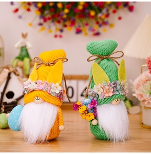 Detail of knitted Easter gnomes with rabbit ears, colorful flowers, and decorative eggs