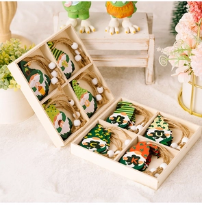 St. Patrick's Day wooden gnome ornaments with clovers and LUCK letters in a wood box