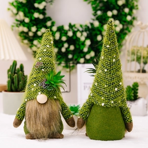 Detail of knitted forest gnomes featuring artificial succulent elements and soft plush beards