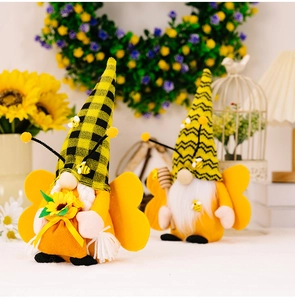 Detail of bee themed Gnomes with knitted hats and sunflower accents in a cozy home setting