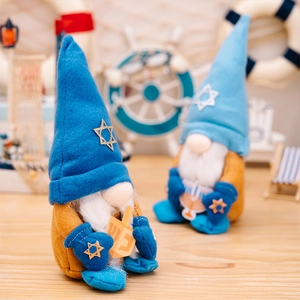 Detail of Hanukkah gnomes holding wooden dreidel and menorah with Star of David