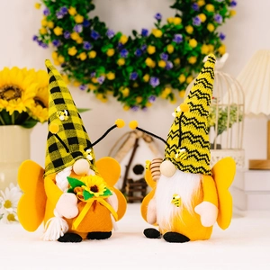 Bee festival gnome plush ornaments with wings and sunflower in a warm garden setting