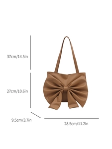 Brown PU leather tote bag with large bow decoration and product dimensions on white background